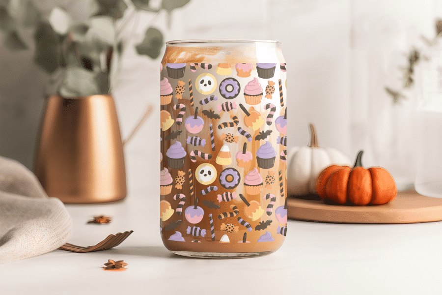 Halloween-Themed Glass With A Coffee Drink And A Candy Pattern.