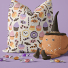 Halloween Pillow With Candy Pattern And A Small Pumpkin Wearing A Witch'S Hat.