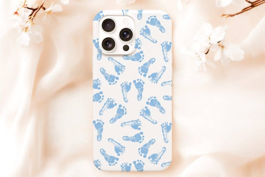 White Iphone Case With A Pattern Of Light Blue Baby Footprints.