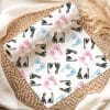 A Roll Of Wrapping Paper With A Pattern Of Pink, Blue, And Black Baby Footprints.