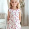 Girl In A White Dress With Pink Baby Footprints.