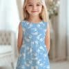 Girl Wearing A Light Blue Dress With A White Baby Footprint Pattern.