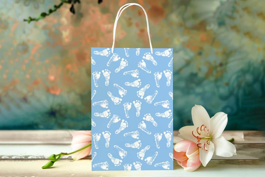 Light Blue Gift Bag With A Pattern Of White Baby Footprints.