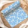 Light Blue Wrapping Paper Roll With A Pattern Of White Baby Footprints.