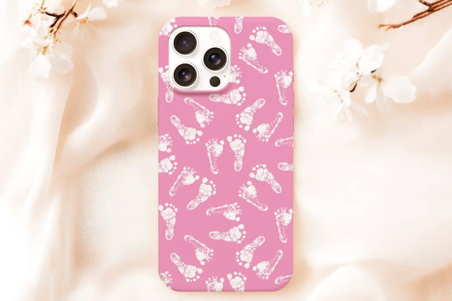 Pink Phone Case With A Pattern Of White Baby Footprints.