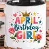 A Coffee Mug With The Text April Birthday Girl, Decorated With A Crown, Hearts, Stars, And Flowers.