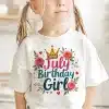 A Young Girl Wearing A White Shirt That Says July Birthday Girl, Decorated With A Crown And Roses.