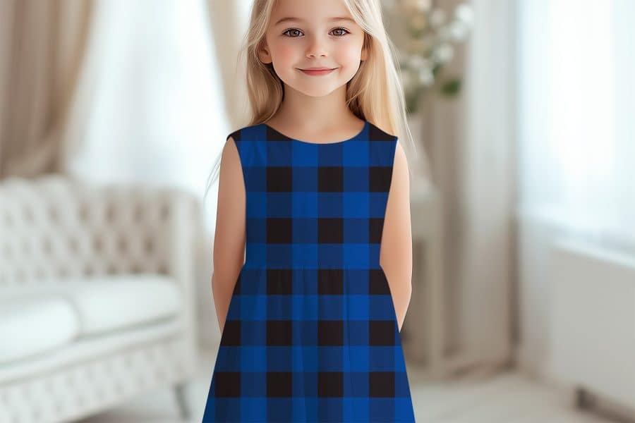 A Young Girl Wearing A Blue And Black Buffalo Plaid Sleeveless Dress.