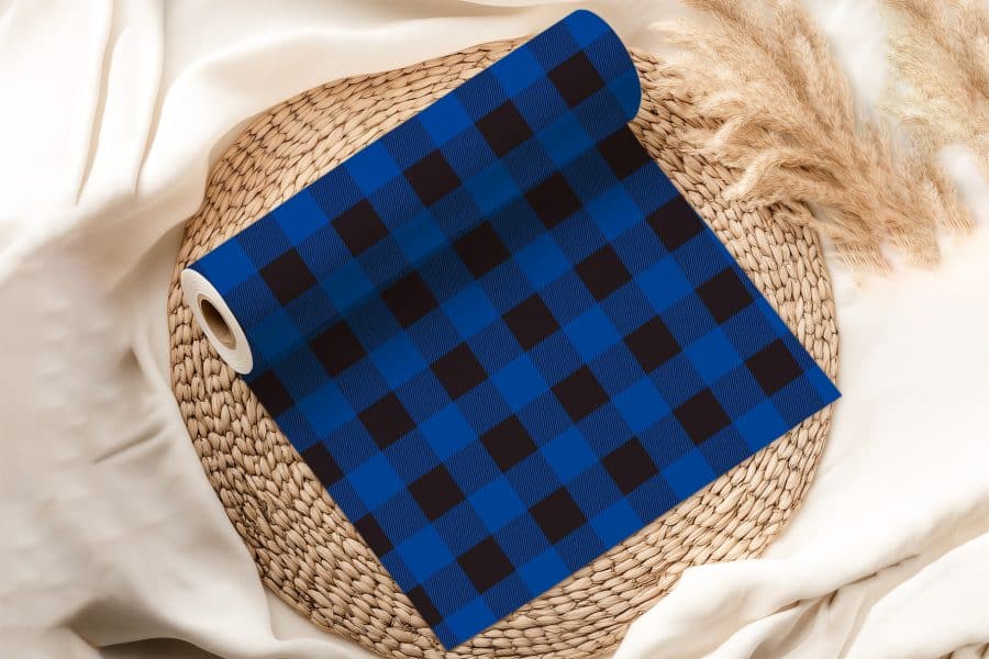 Roll Of Blue And Black Buffalo Plaid Fabric.