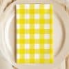 Yellow And White Checkered Napkin On A Beige Plate.