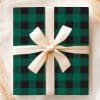 Green And Black Buffalo Plaid Gift Box With A Cream-Colored Ribbon.