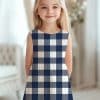 Girl Wearing A Navy And White Gingham Dress.