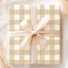 Beige And White Gingham Gift Box With A Beige Ribbon Tied In A Bow.