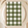 Olive Green And White Checkered Napkin On A Beige Plate.