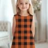 Young Girl In An Orange And Black Plaid Dress.