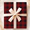 A Red And Black Buffalo Plaid Gift Box With A Cream-Colored Ribbon.