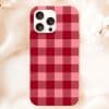 Phone Case With Red And Pink Plaid Pattern.