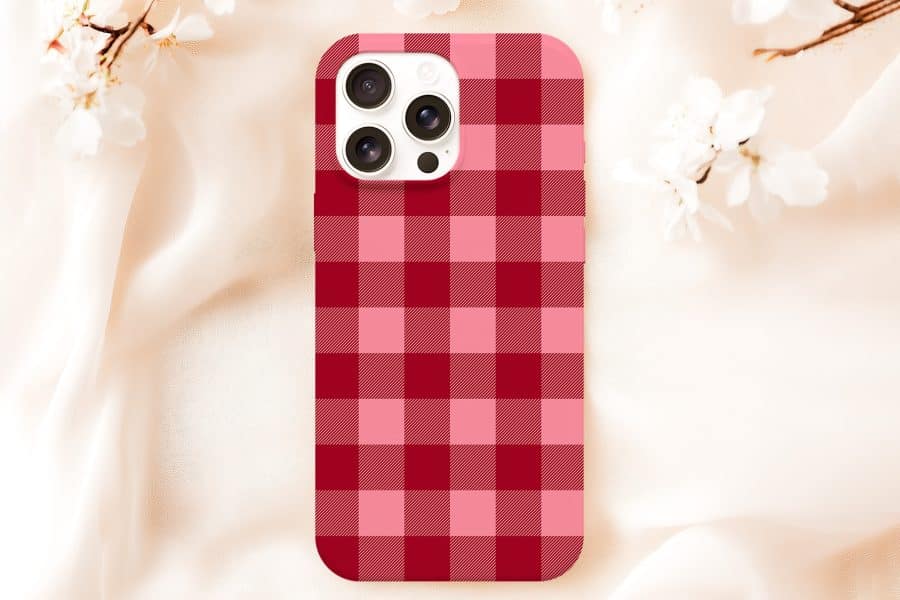 Phone Case With Red And Pink Plaid Pattern.