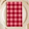 Red And Pink Checkered Napkin On A White Plate.