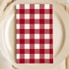 Red And White Checkered Napkin On A Beige Plate.