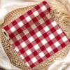 Roll Of Red And White Gingham Fabric.