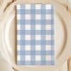 Blue And White Gingham Napkin On A Plate.