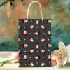 Black Halloween Gift Bag With A Candy Corn Pattern.