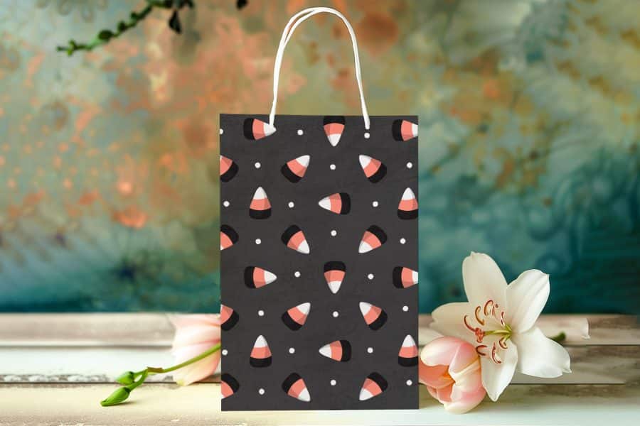 Black Halloween Gift Bag With A Candy Corn Pattern.