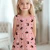 Girl Wearing A Pink Dress With Candy Corn Pattern.