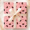 Pink Gift Box With Candy Corn Pattern And Beige Ribbon.