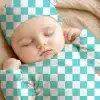 Sleeping Baby Wearing A Teal And White Checkered Hat And Bodysuit.