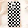 White Phone Case With A Black And White Checkered Pattern.