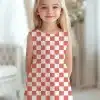 Girl In Coral And White Checkered Dress.