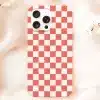 Phone Case With Coral And White Checkered Pattern.