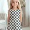 Young Girl Wearing A Sleeveless Checkered Dress.