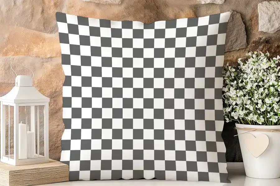 Checkered Throw Pillow With Dark Gray And White Squares.