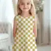 Young Girl Wearing A Gold And White Checkered Dress.