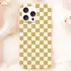A Gold And White Checkered Phone Case.