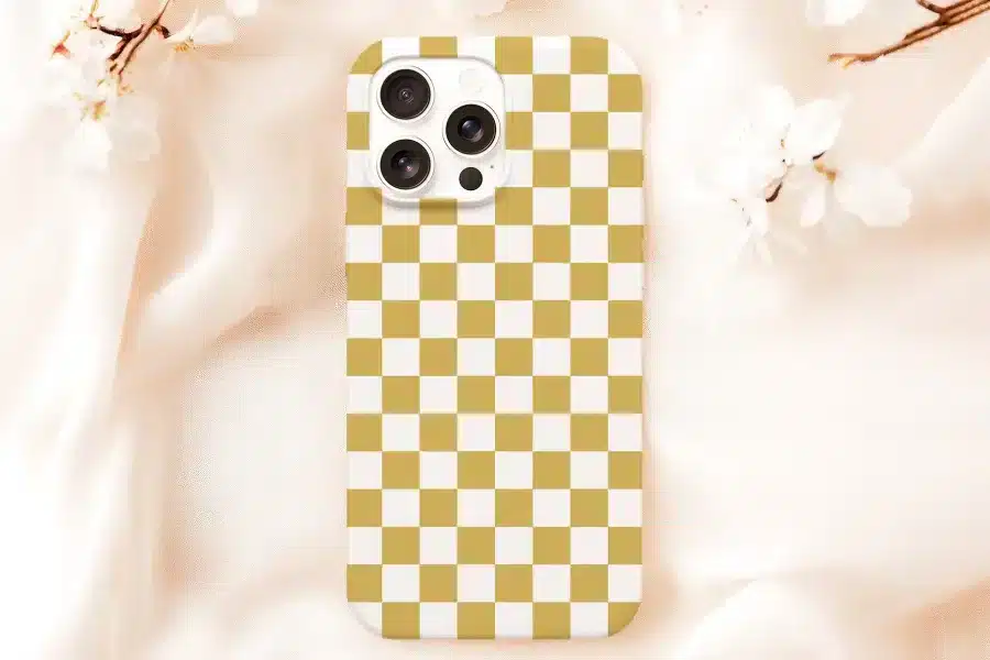 A Gold And White Checkered Phone Case.