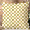 A Mustard Yellow And White Checkered Throw Pillow.