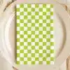 Lime Green And White Checkered Napkin On A Beige Plate.