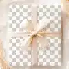 A Gift Box With A Light Beige Ribbon Tied In A Bow.