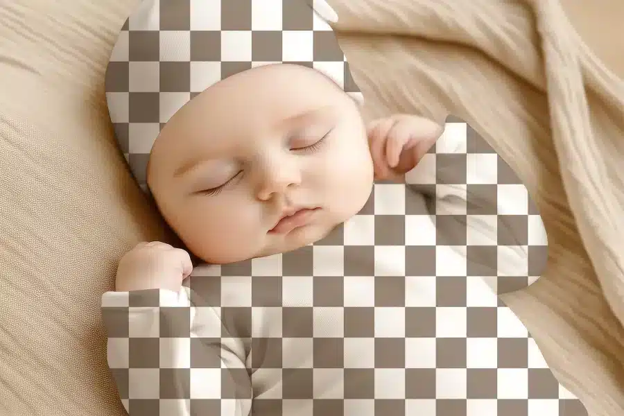 Sleeping Baby Wearing A Checkered Hat And Outfit.