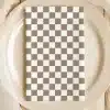 Beige And White Checkered Napkin On A Beige Plate.