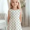 Girl Wearing A Sleeveless Checkered Dress.