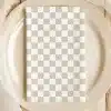 Beige Checkered Napkin On A Beige Plate.