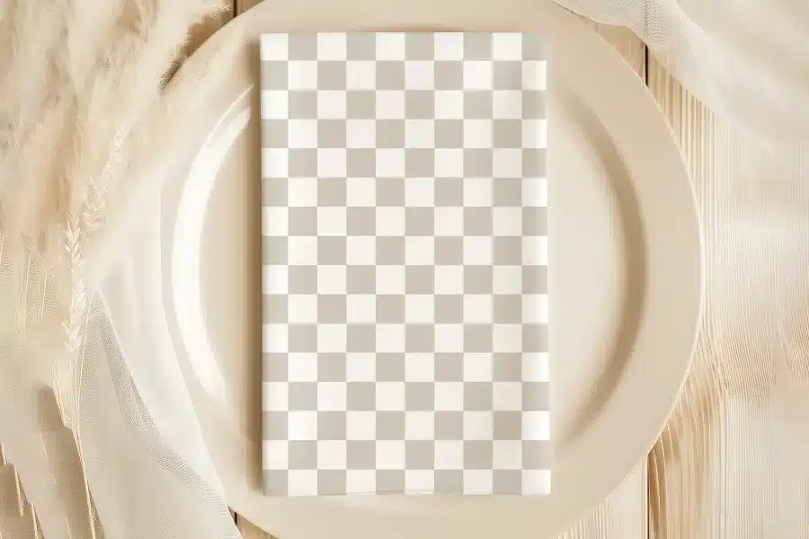 Beige Checkered Napkin On A Beige Plate.