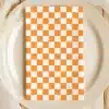 Orange And White Checkered Napkin On A Beige Plate.