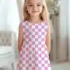 Young Girl Wearing A Pink And White Checkered Dress.