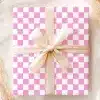 Pink And White Checkered Gift Box With A Beige Ribbon.